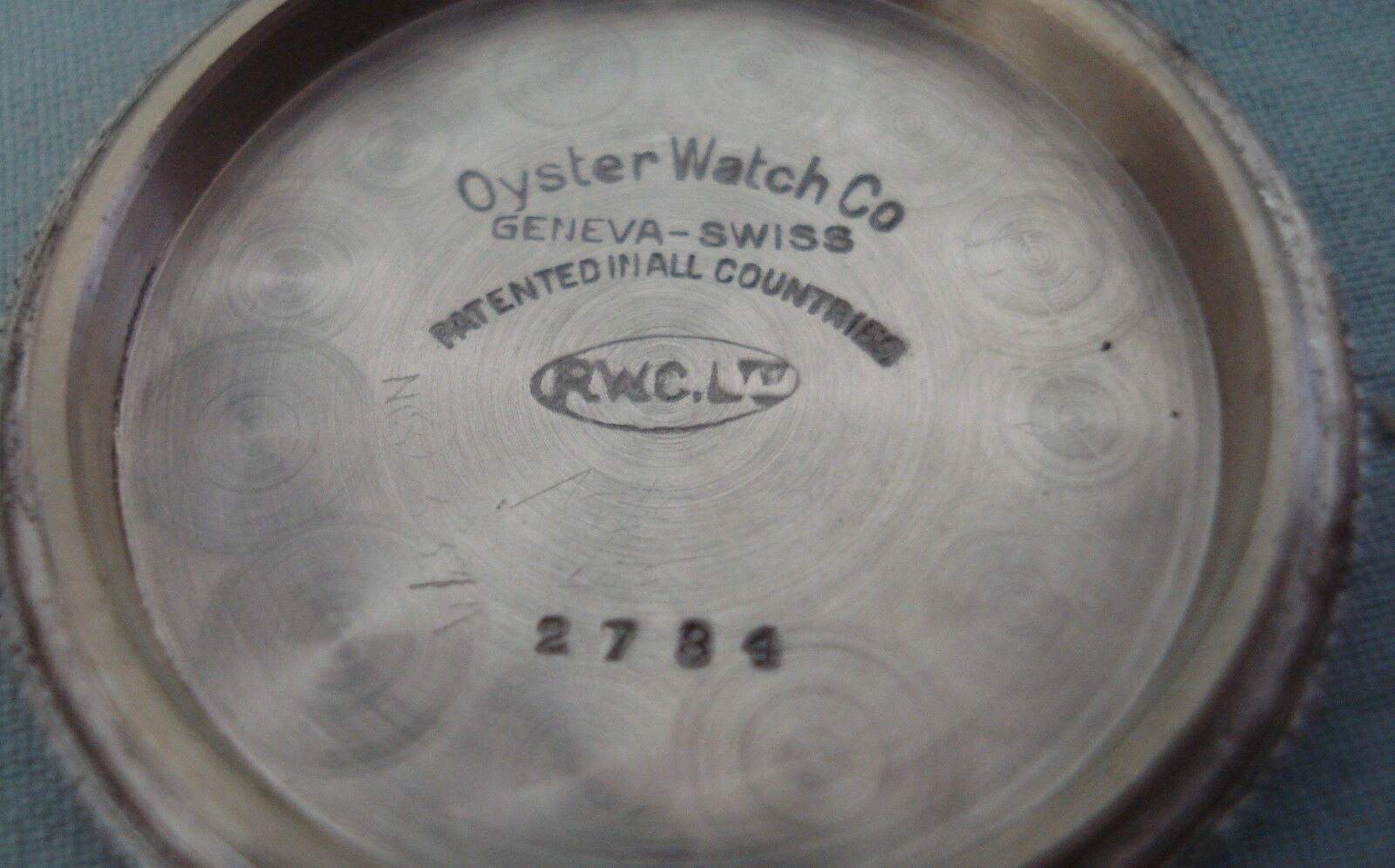 Rolex automatic movement showing perlage and crown-engraved rotor