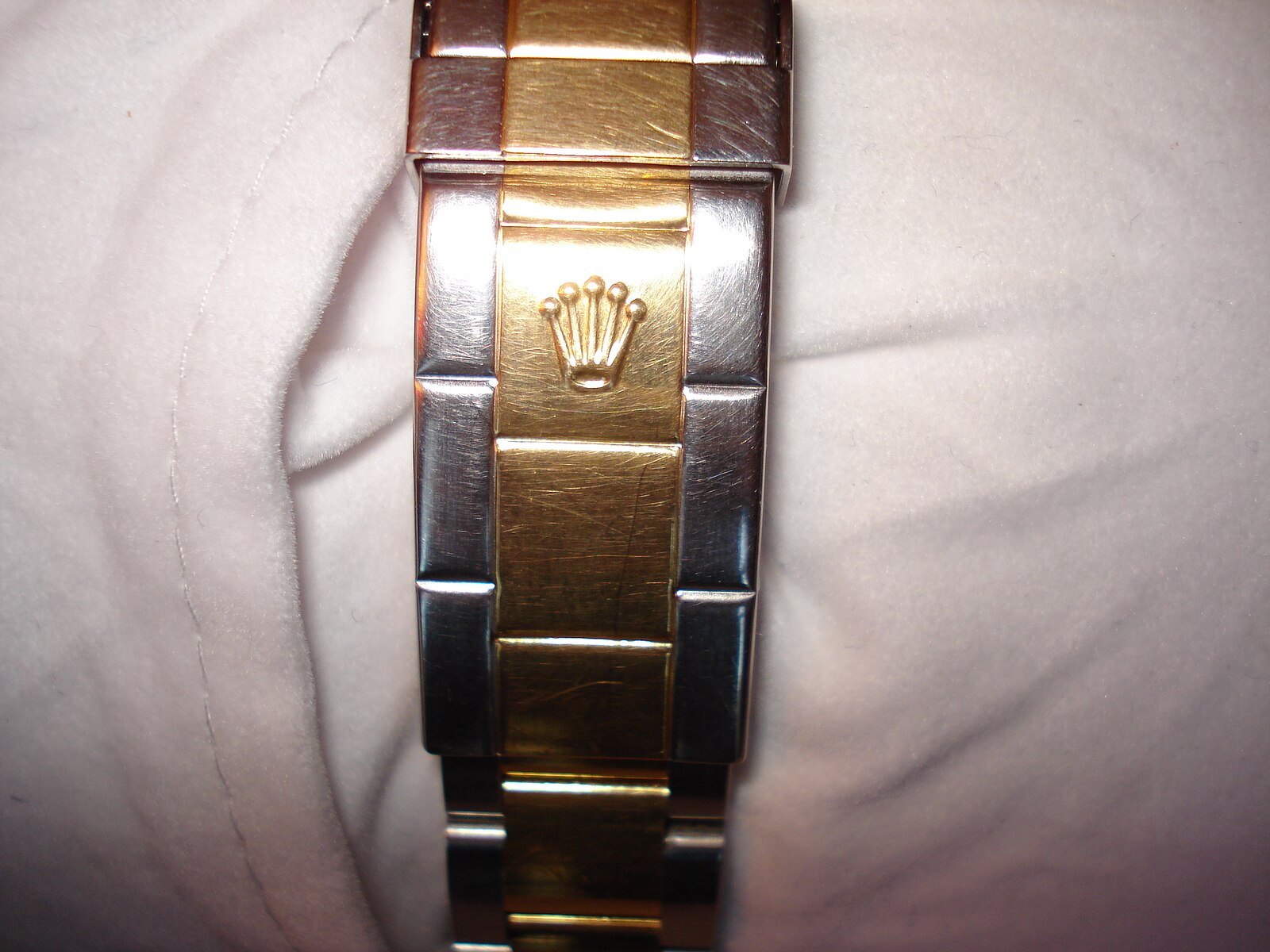 Close-up of the Rolex rehaut showing repeating ROLEX engraving